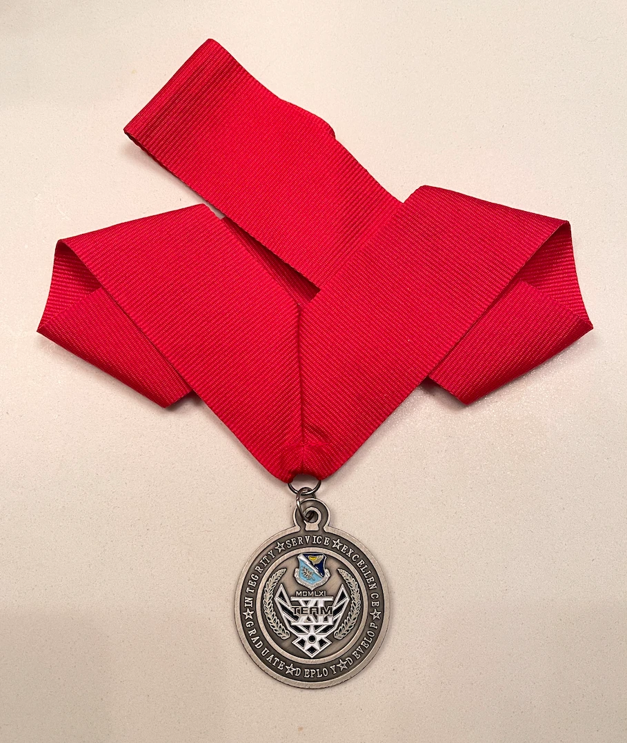 The Awards Banquet medal I designed — my own, received for Base Airman of the Year